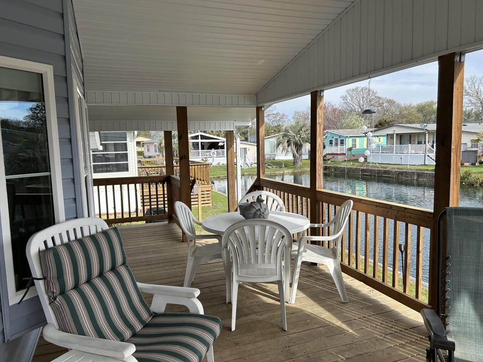 Relax on the spacious screened porch with waterfront views