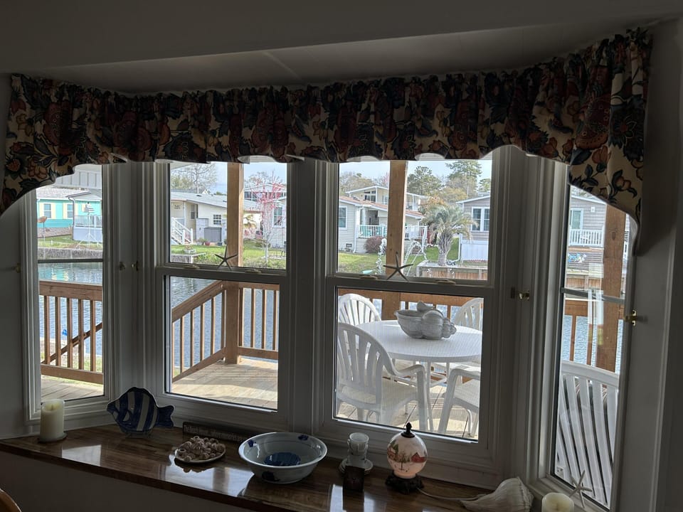 Cozy dining nook with scenic waterfront views and natural light
