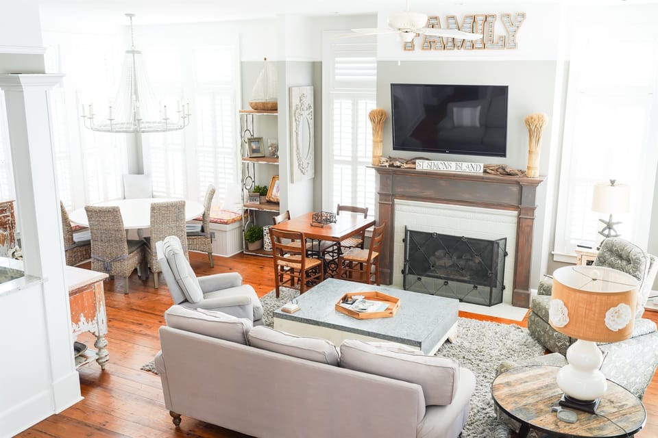 Bright, airy living space with gas fireplace and open layout.