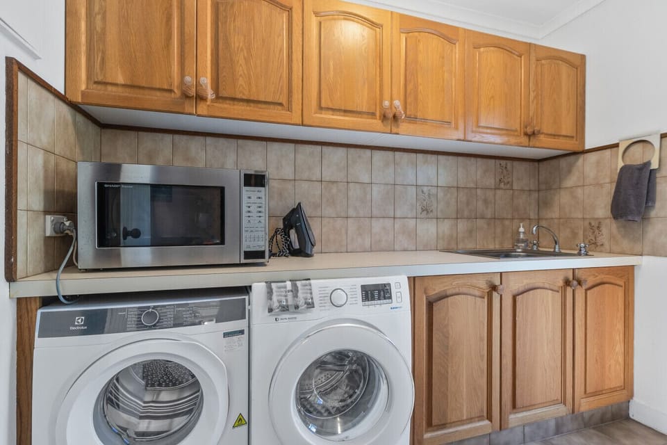 Downstairs Laundry has washing machine, dryer and a microwave.
