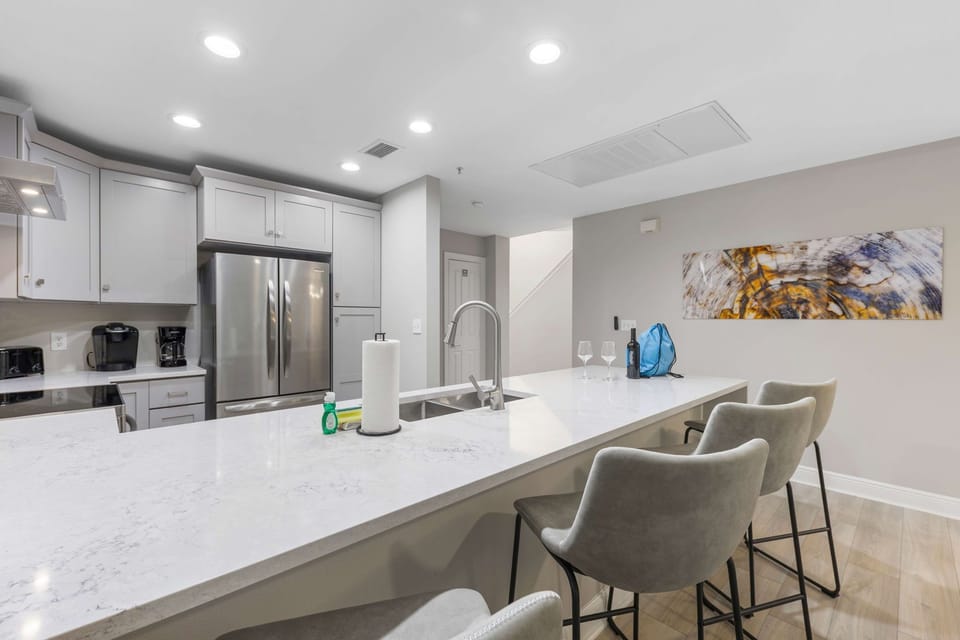 Sit down at the bar top whilst the family cooks up some home cooked meals
