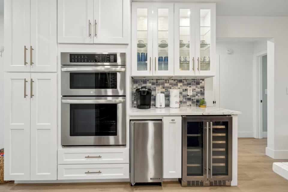 Oven, microwave, ice machine, wine cooler, Keurig coffee machine.