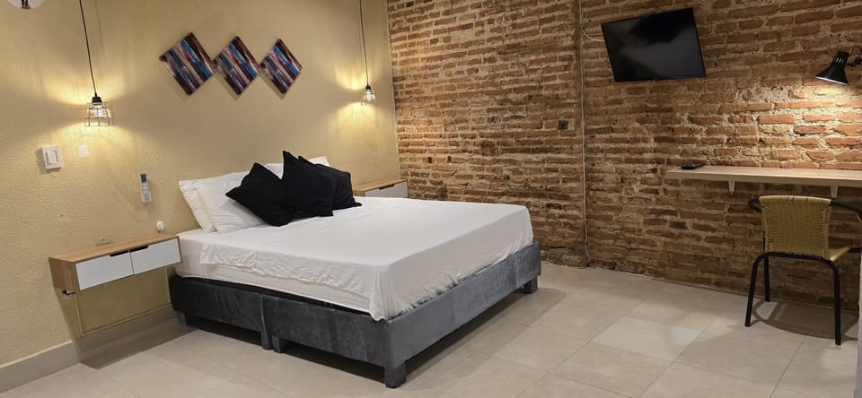 Deluxe Triple Room | Desk, laptop workspace, iron/ironing board, free WiFi