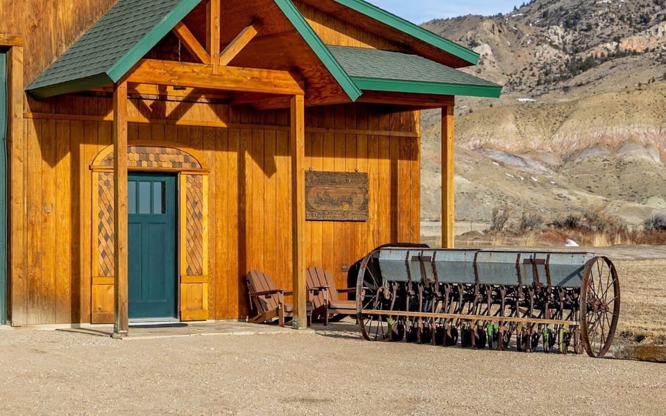 Outdoor entrance to the apartment with seating and a gas grill