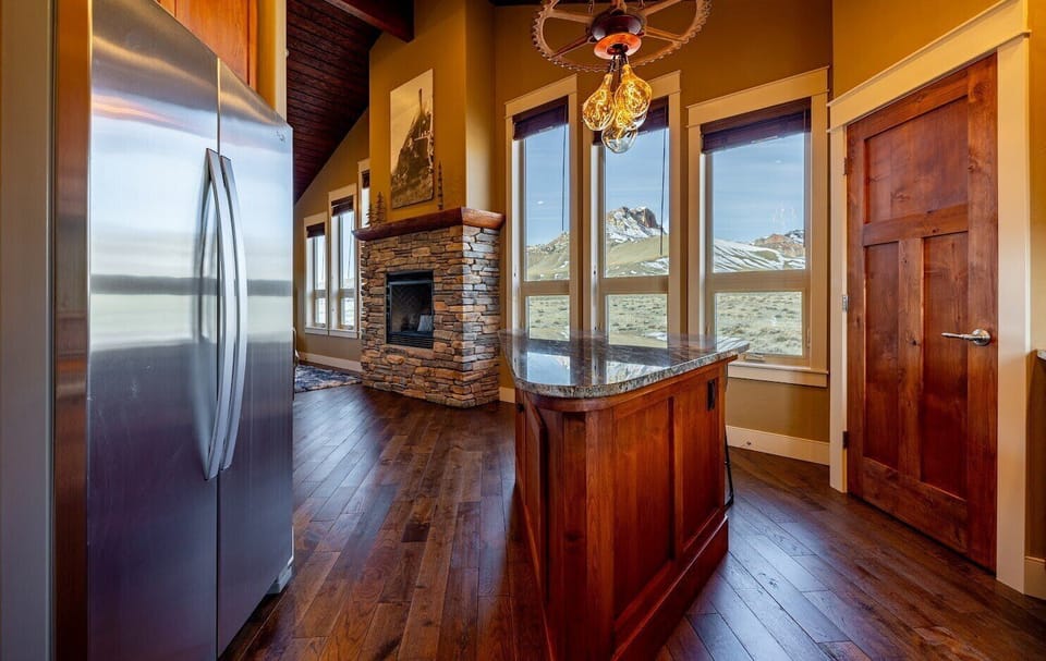 The kitchen features custom cabinets and modern appliances