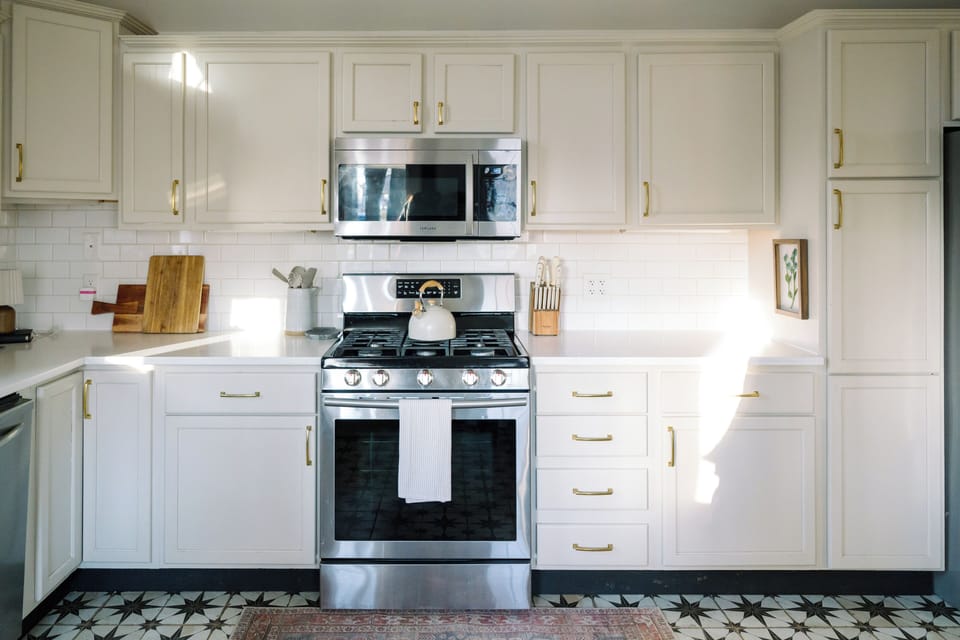 Stainless steel appliances and fully stocked kitchen
