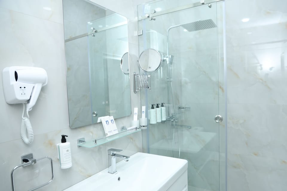 Standard Twin Room, City View | Bathroom | Shower, hair dryer, slippers, towels