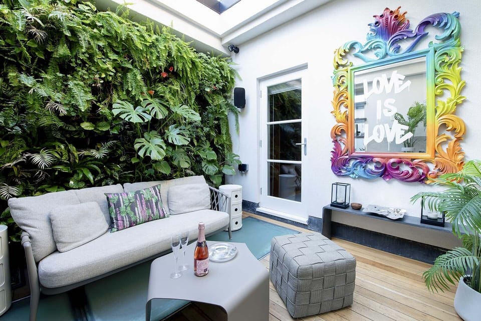 A retractable glass roof makes this a lovely outdoor space in nice weather.