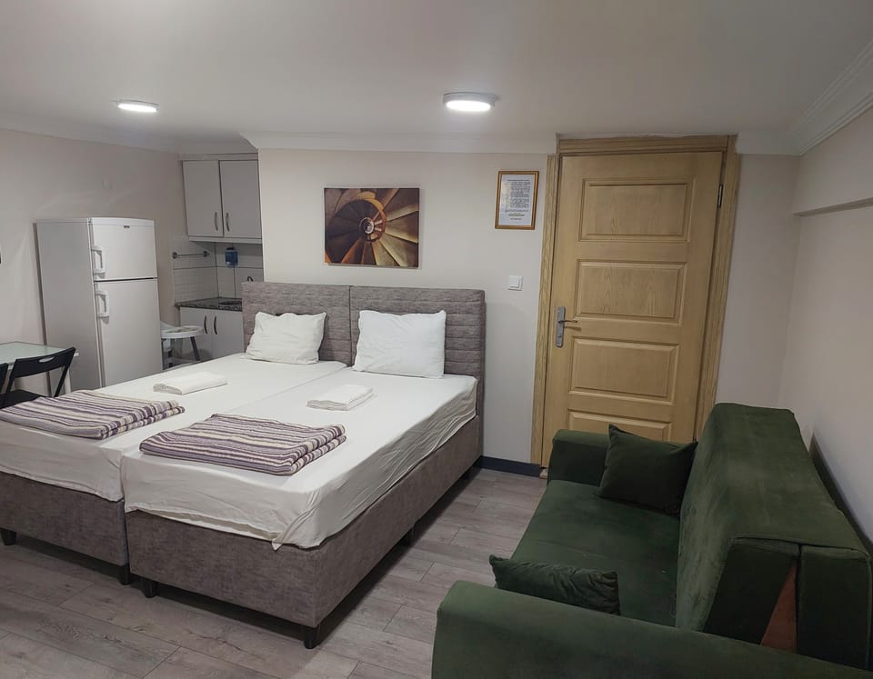 Family Quadruple Room, City View | Premium bedding, desk, laptop workspace, soundproofing