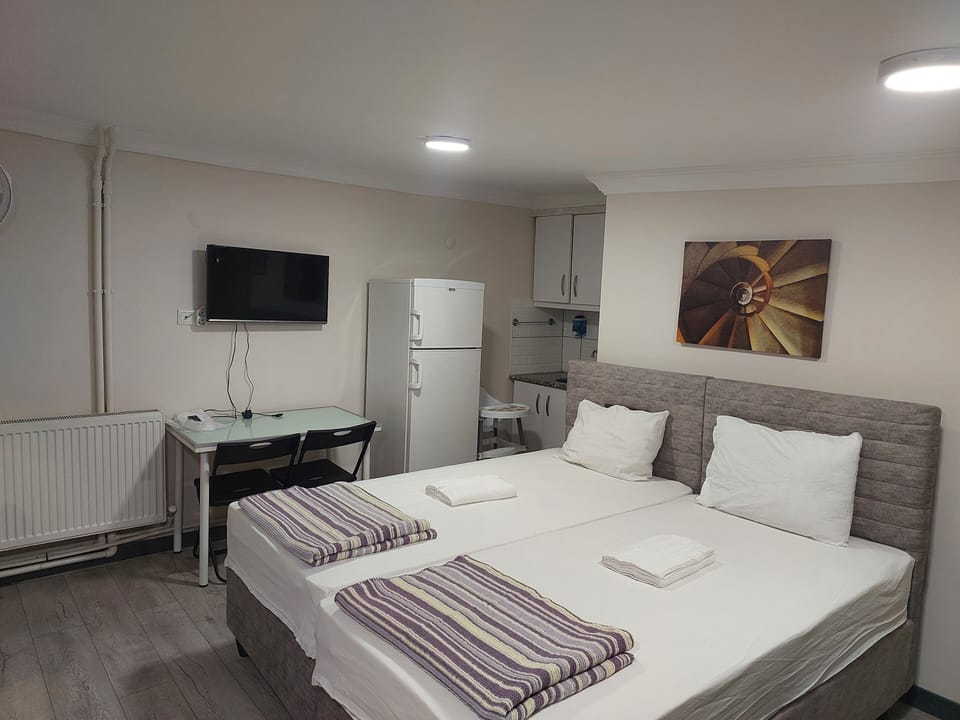 Family Quadruple Room, City View | Premium bedding, desk, laptop workspace, soundproofing
