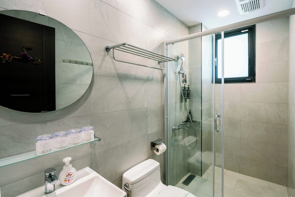 Shower, hair dryer, slippers, towels