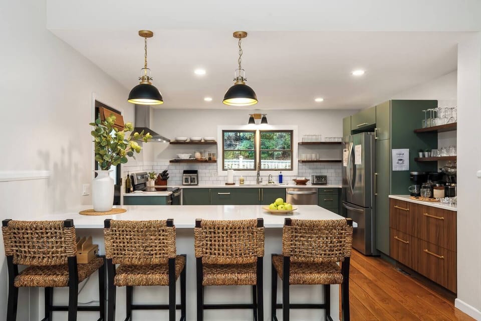 Elegant Kitchen: Sleek design with modern appliances and ample seating for culinary adventures! We have it all: air fryer, stand mixer, waffle maker, blender, and small utensils, too!