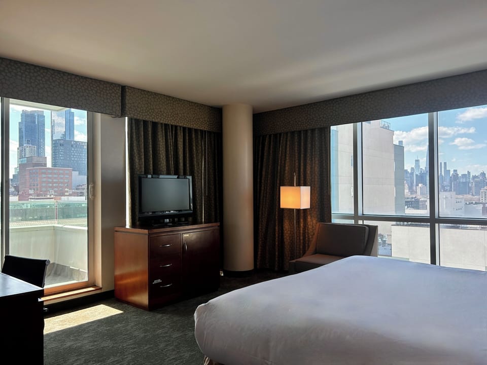 Deluxe King Room with Balcony -ADA | Desk, laptop workspace, iron/ironing board, free WiFi