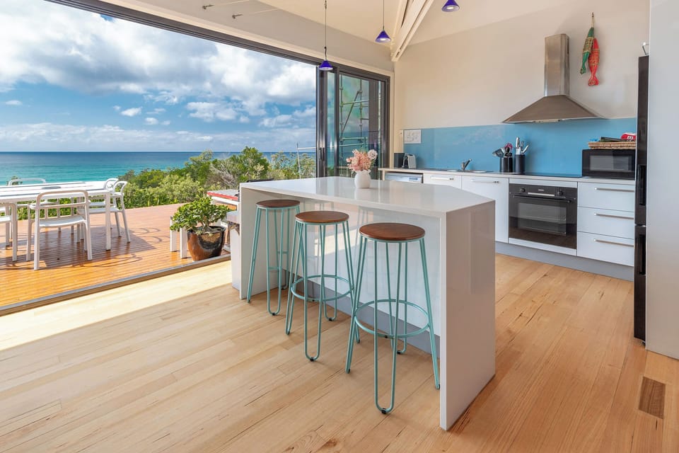 Spacious kitchen area with island for casual dining.