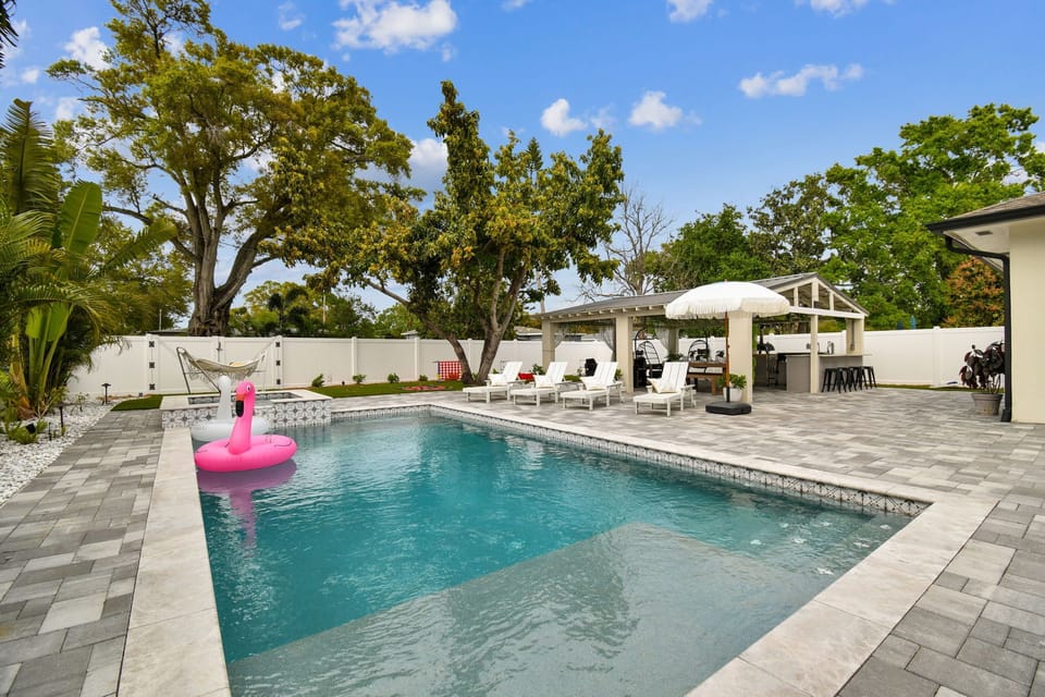 Private pool with lounge chairs & floaties for ultimate relaxation.