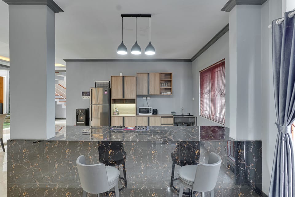 Villa, Patio, Pool View | Private kitchen | Dining table
