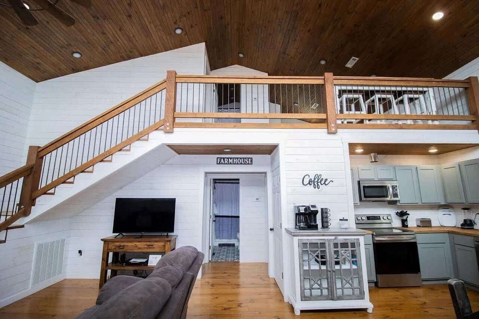 Open-concept living room with cozy seating, streaming-ready Smart TV with cable through Hulu Live, board games and a dedicated workspace—perfect for family gatherings.