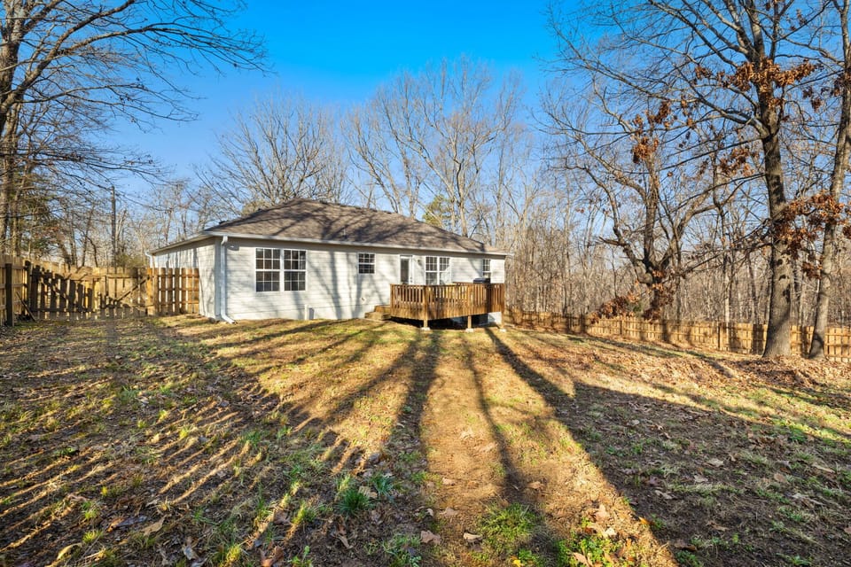 At home enjoy amenities for 7 in our 3-bedroom, 2-bathroom home including a fully stocked kitchen, cozy living room, and large fenced in back yard with seating - perfect to bring the dogs along!