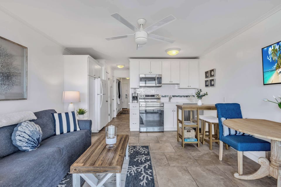 Catch the game or catch the waves—your choice! 🏖️📺 This living room offers comfort, style, and spectacular views. #BestOfBothWorlds
