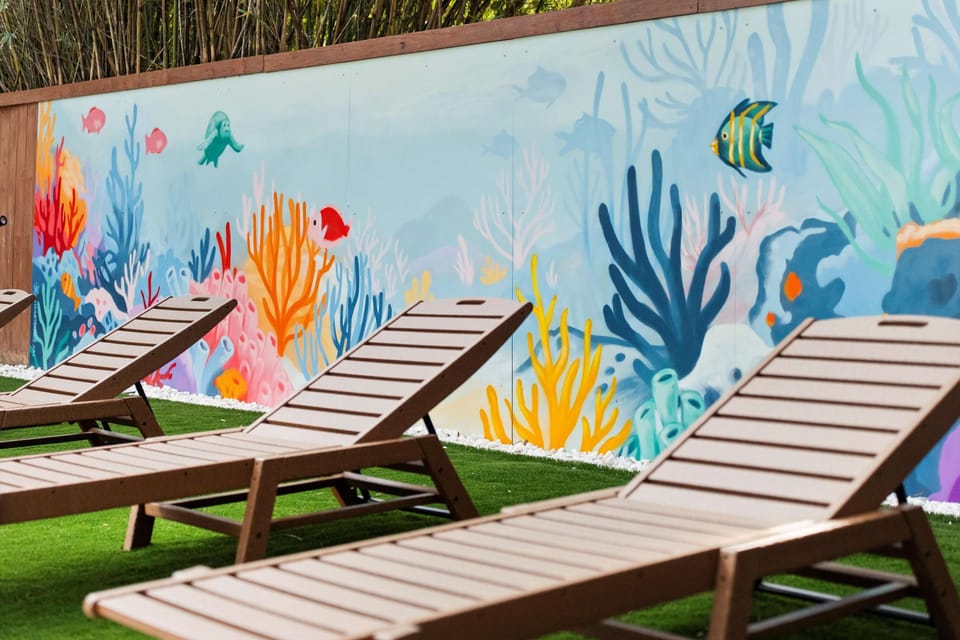 Lots of opportunities for family pictures in front of our bold mural. Feels like you're at the bottom of the ocean!