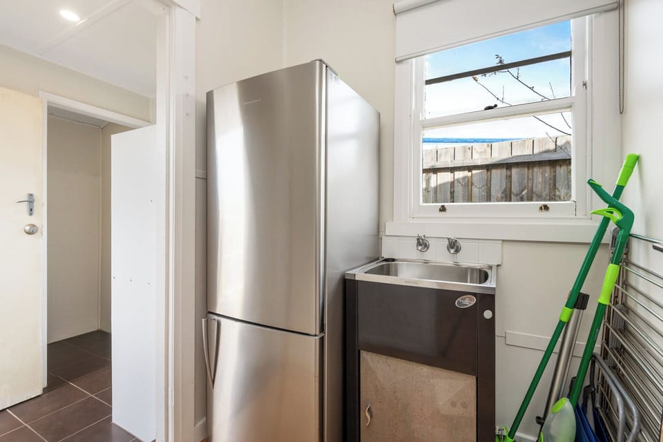 Large fridge and laundry area