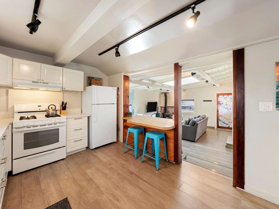 The airy kitchen offers ample space & all the comforts of home