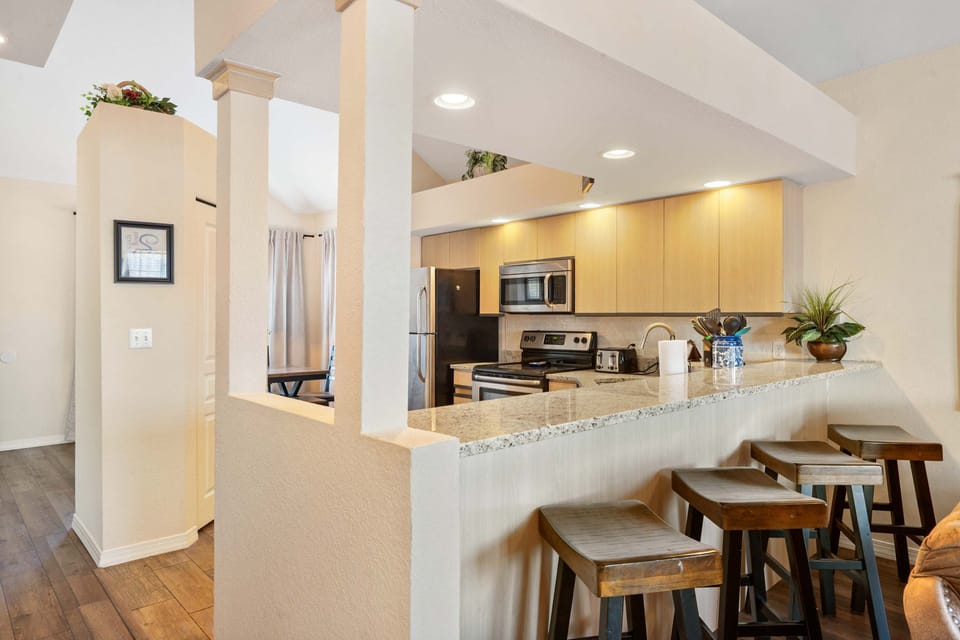 Sip morning coffee or grab a bite at the kitchen counter, seating 4