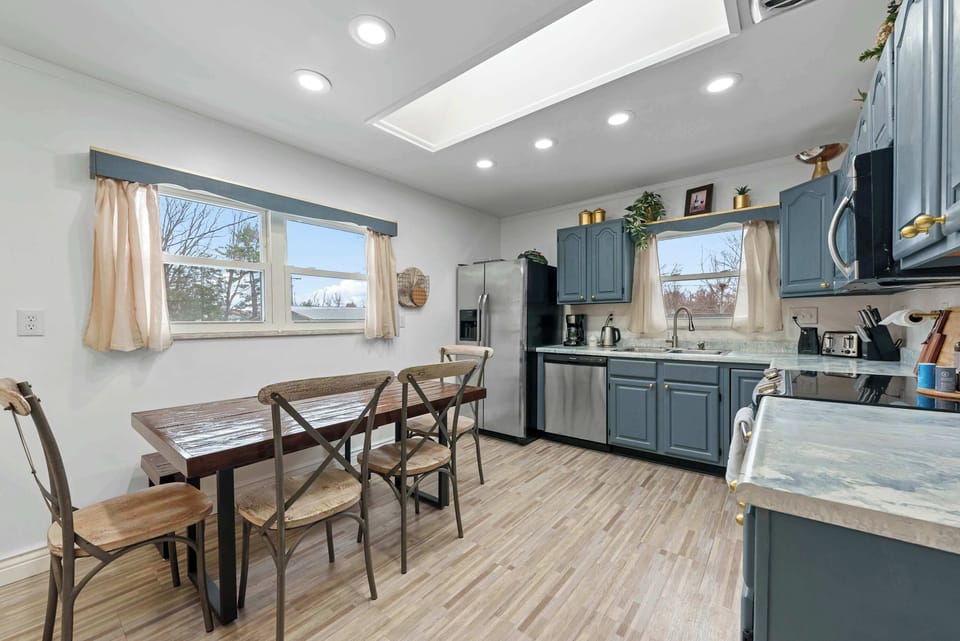 The updated eat-in kitchen offers ample space & every home comfort