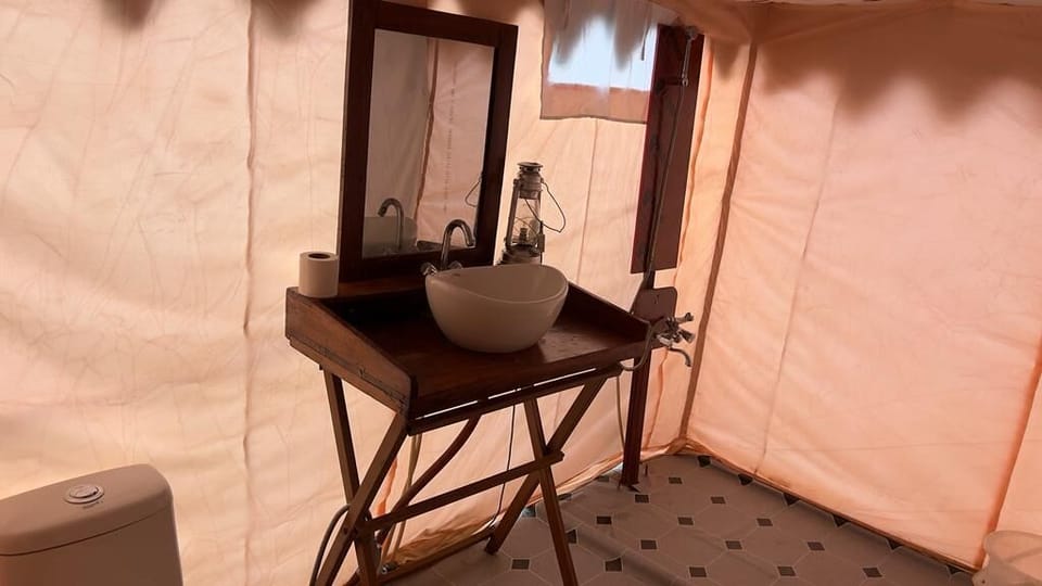 Deluxe Tent, Balcony, Hill View | Bathroom | Free toiletries, towels, soap, shampoo