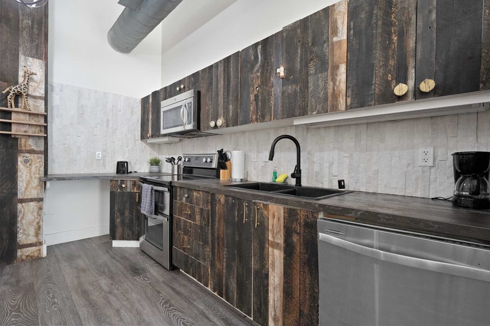 Rustic-modern kitchen with textured cabinetry and sleek counters