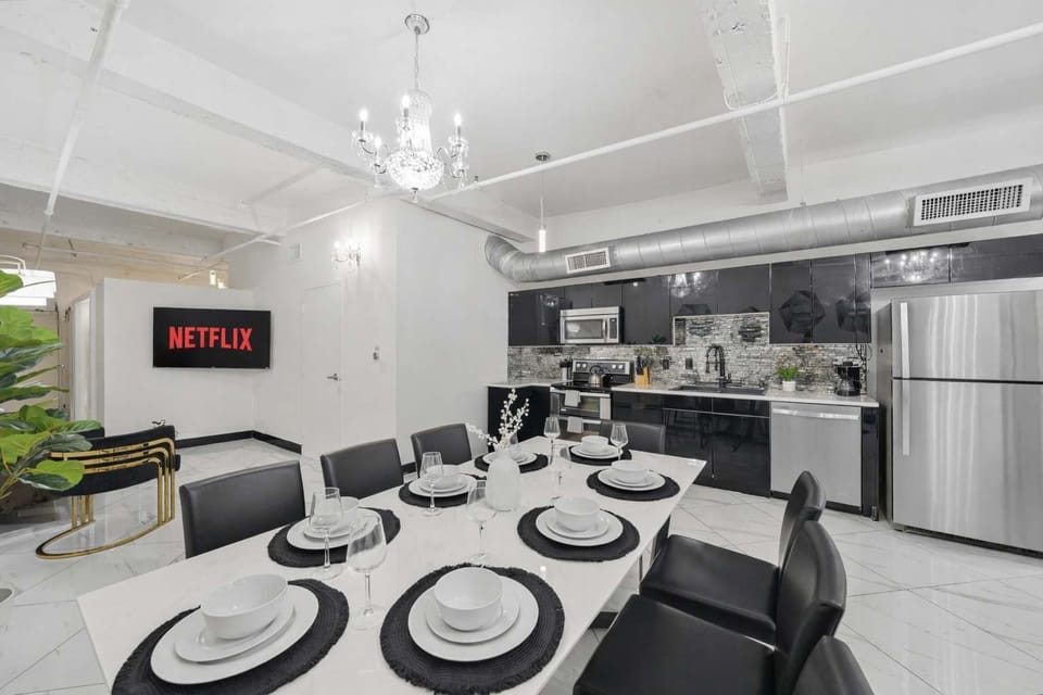 Dining table with modern place settings and décor.