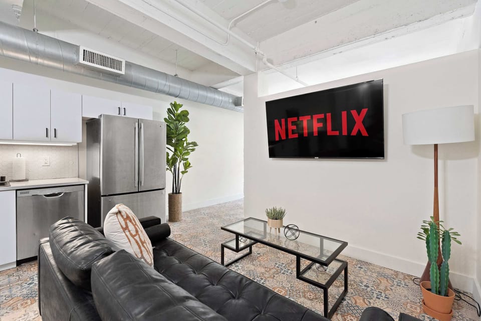 Cozy living room with smart TV and comfortable seating