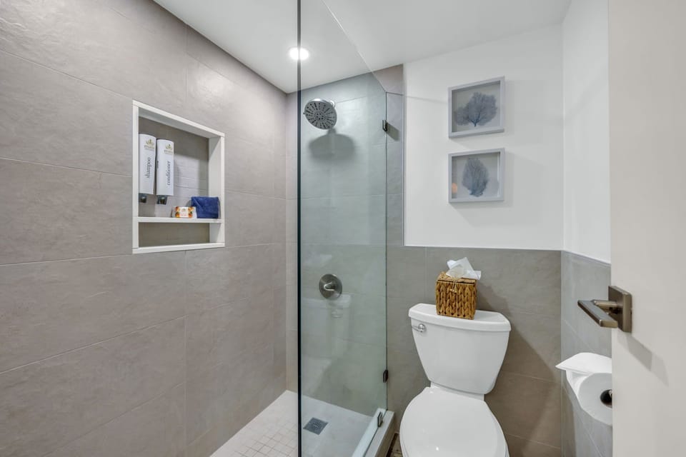 Private ensuite bathroom offering convenience, comfort, and plenty of space to refresh after a day at the beach.