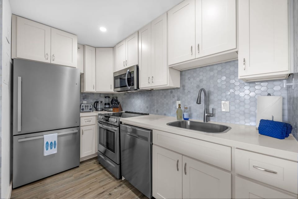 Kitchen - Well stocked with several appliances. Drip Coffee Maker with reusable Gold Filter, Ground Coffee & Filtered Water Pitcher provided.