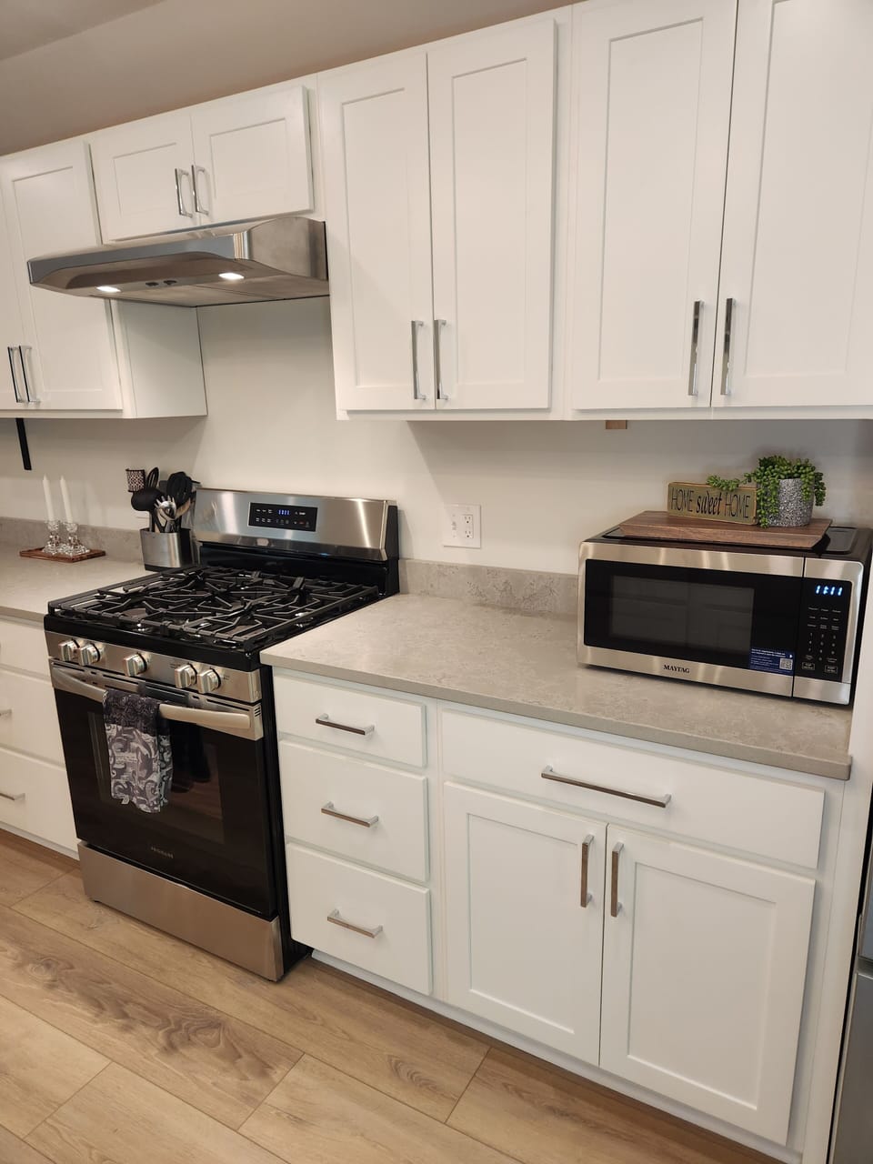 Fully stocked kitchen cabinets with everything you'll need for your stay! 