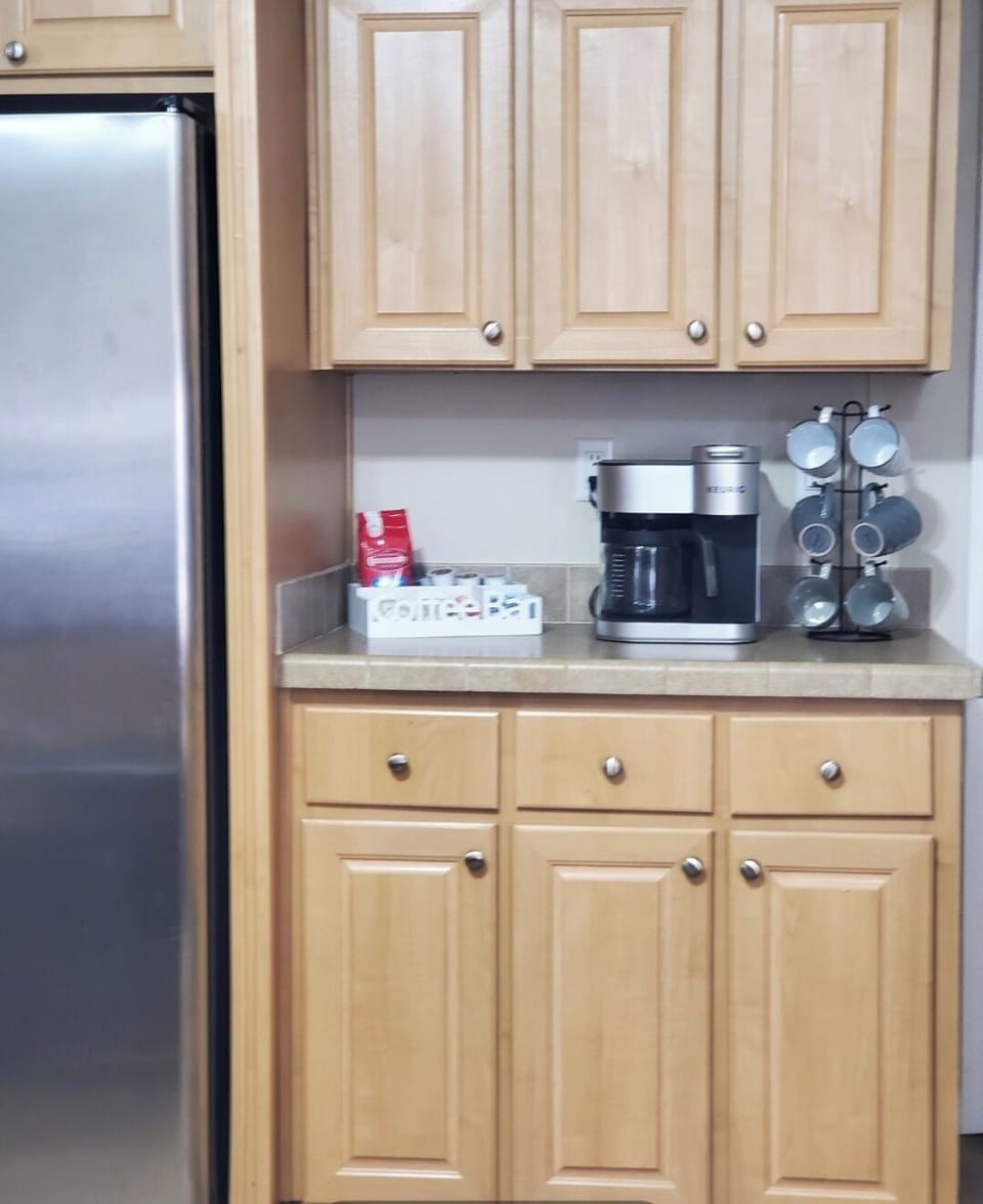 Coffee Bar- Coffee, Creamer and Sweetener.  Coffee pot and K-cups