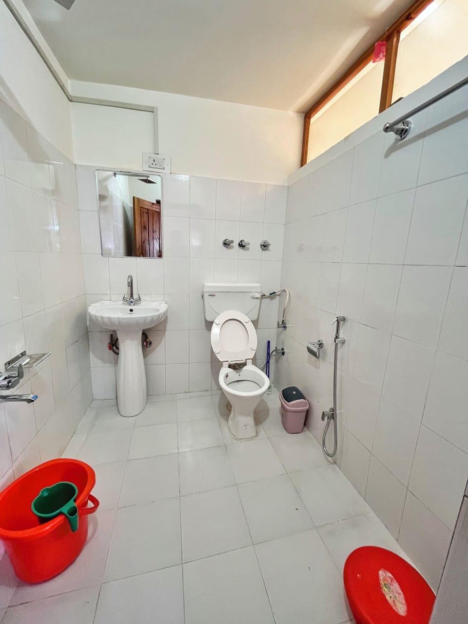 Shower, rainfall showerhead, slippers, towels