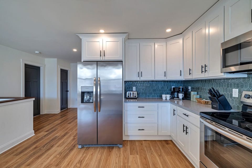 Fully equipped modern kitchen with sleek finishes, ample counter space, and all the essentials for a seamless cooking experience!