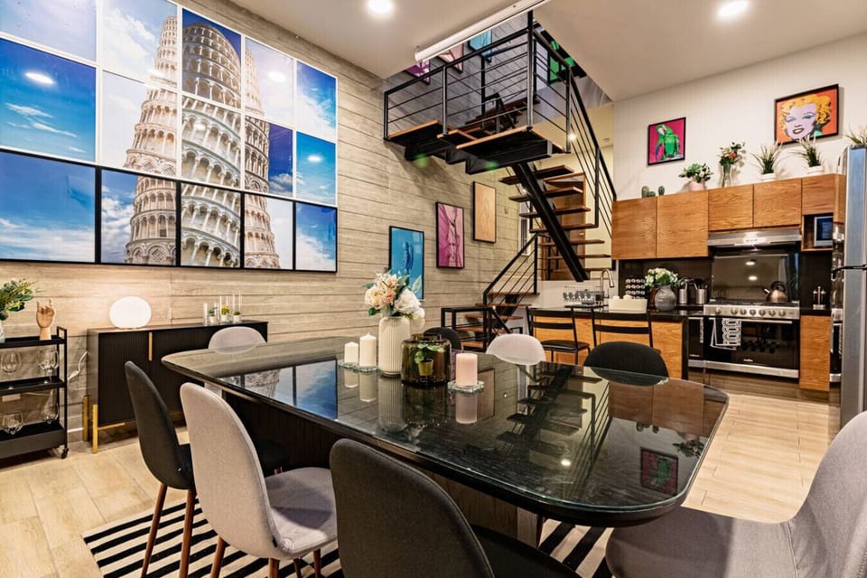 Open-concept kitchen and dining area, featuring sleek design and modern decor