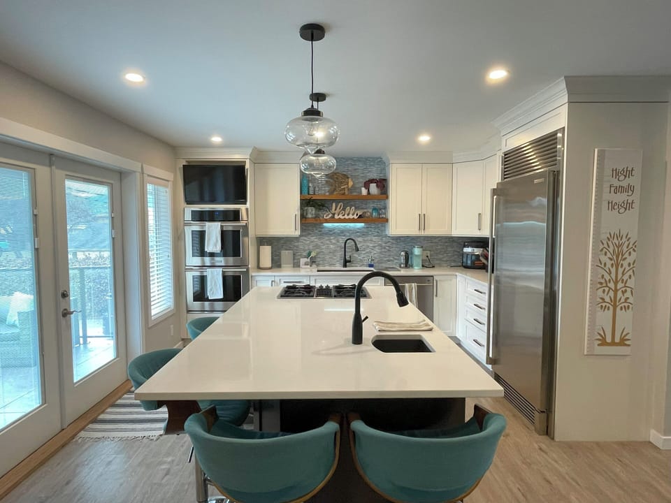 Gourmet kitchen with double ovens and large island