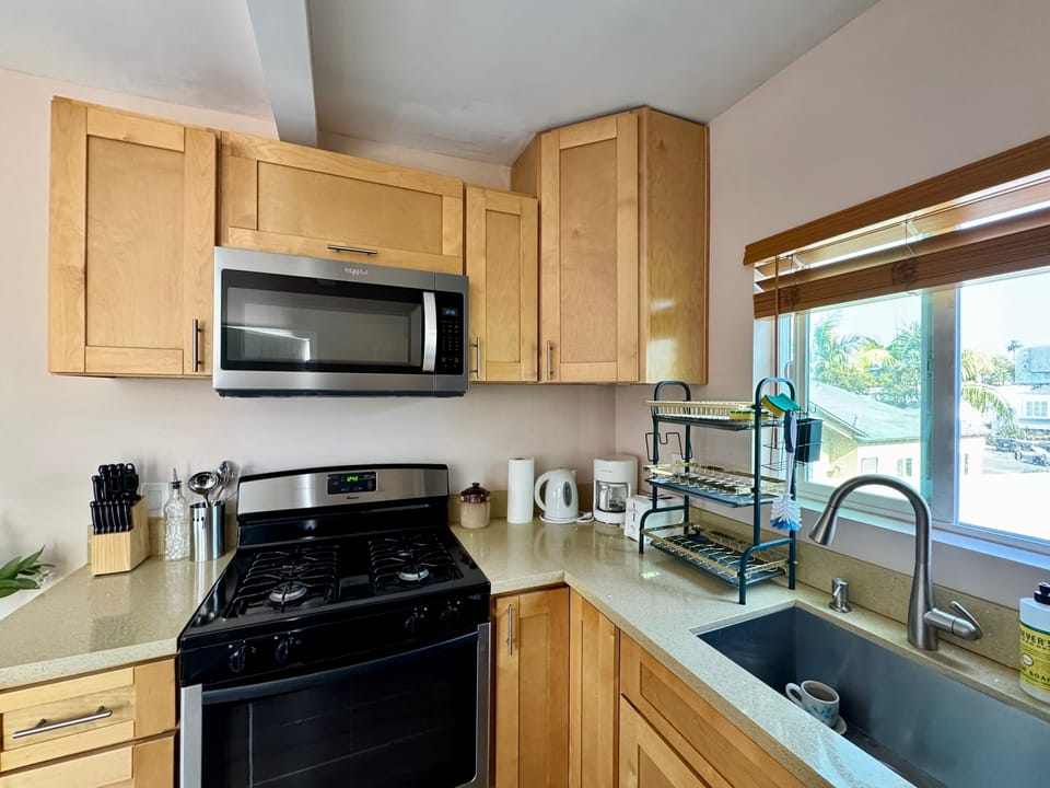 Full Kitchen with many amenities including cookware, stove, oven and full fridge