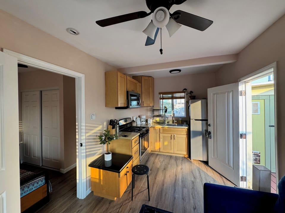 Full Kitchen with many amenities including cookware, stove, oven and full fridge
