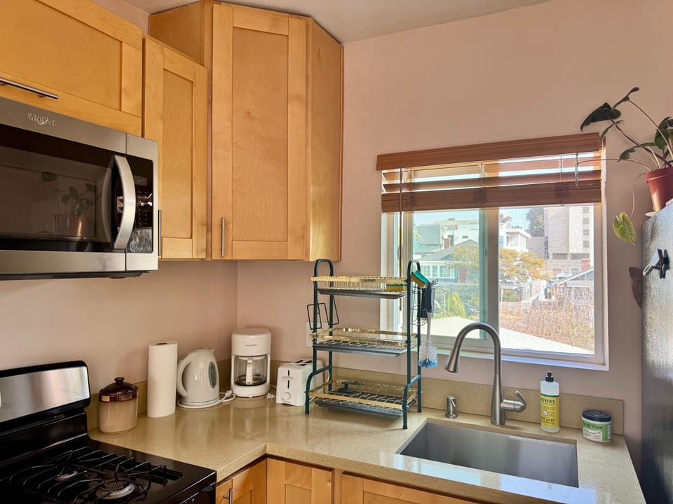 Full Kitchen with many amenities including cookware, stove, oven and full fridge