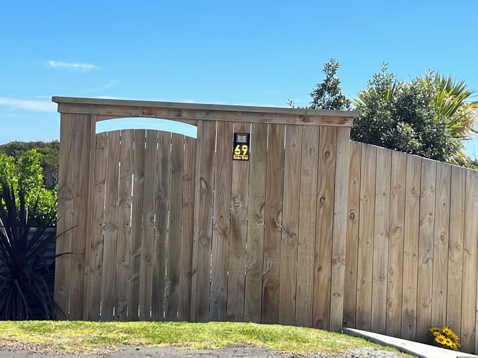 The gate on Karaka St.   the number 69 lights up at night.  Parking here.