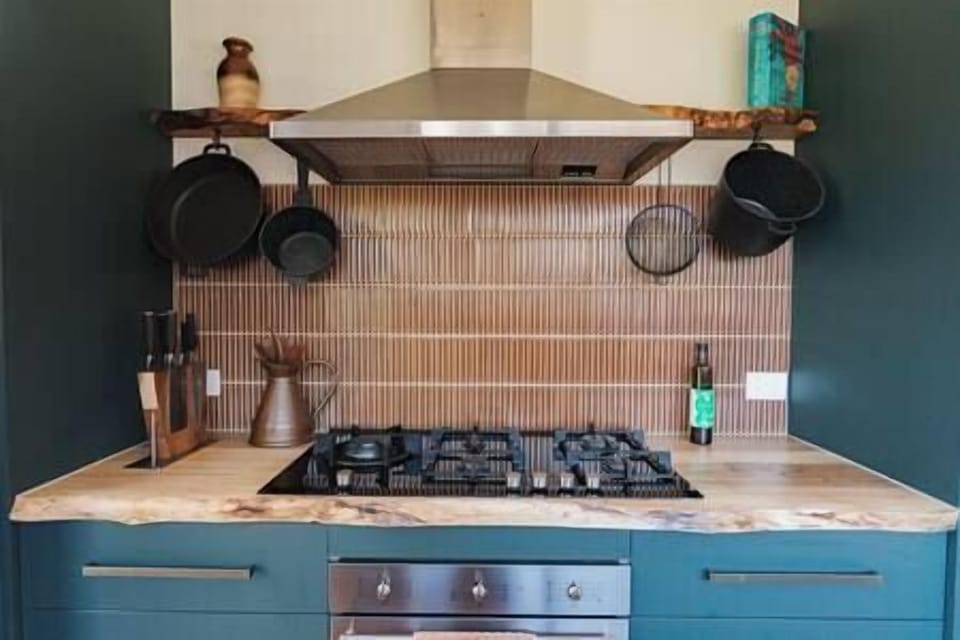 The kitchen is stocked with all utensils and an assortment of pantry basics.