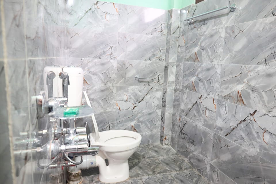 Deluxe Double Room, 2 Bedrooms, Balcony | Bathroom | Shower, slippers, towels, soap