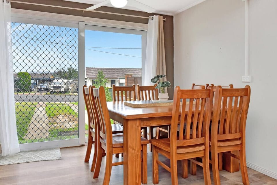 Dining Table 1 on ground floor with driveway, street and neighbourhood view