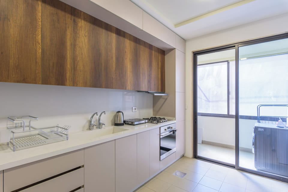 Apartment, 3 Bedrooms, Balcony, City View | Private kitchen | Full-size fridge, microwave, oven, stovetop