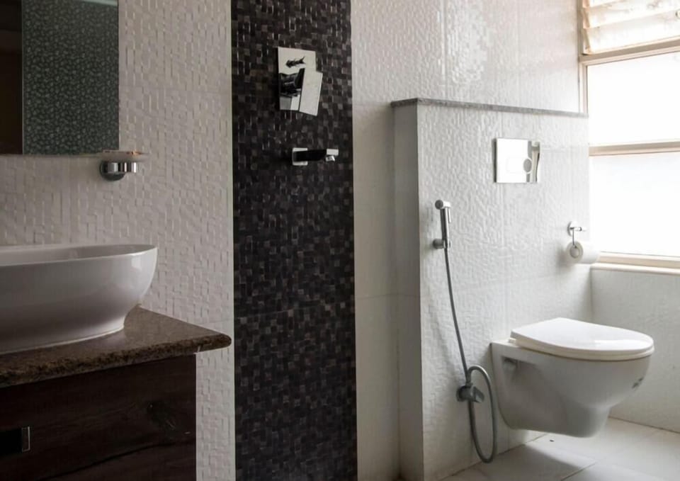 Shower, hair dryer, slippers, towels