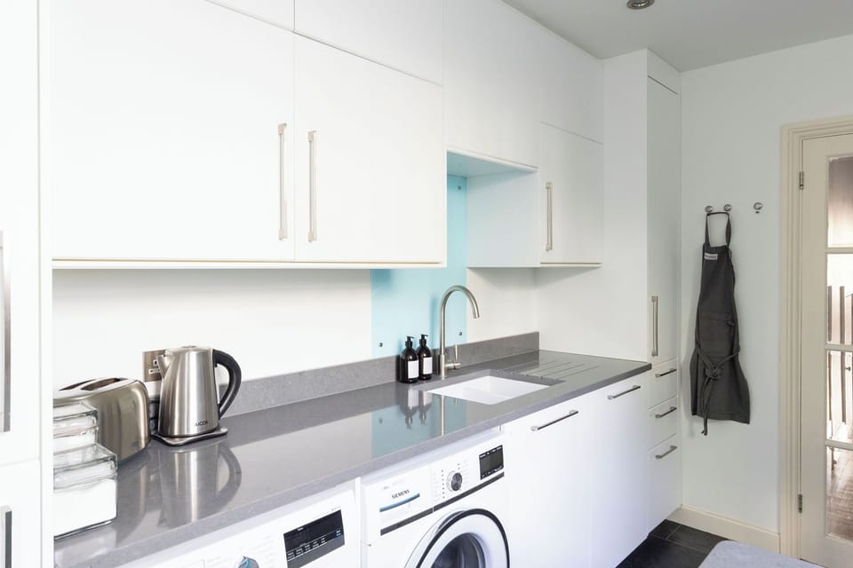 Kitchen sink and utility area. 